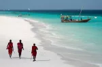 Masai, entertaining tourists on the beach in Nungwi. Zanzibar